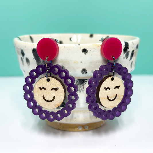 Happy Face Hanging Post Earrings in Purple